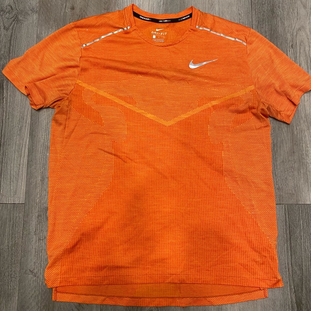 Orange Nike Dri-Fit running shirt